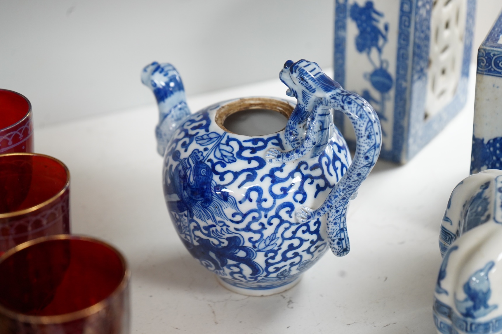 A group of Chinese blue and white comprising a dish and cover, two pillows, waterdropper and a teapot, largest 26cm wide